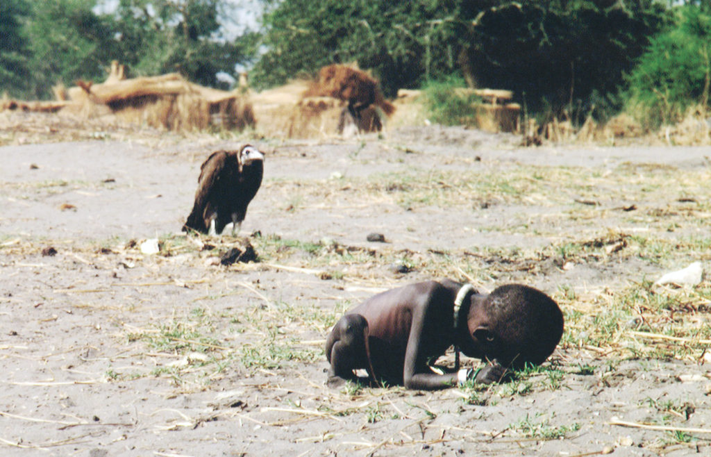 Starving child and a vulture