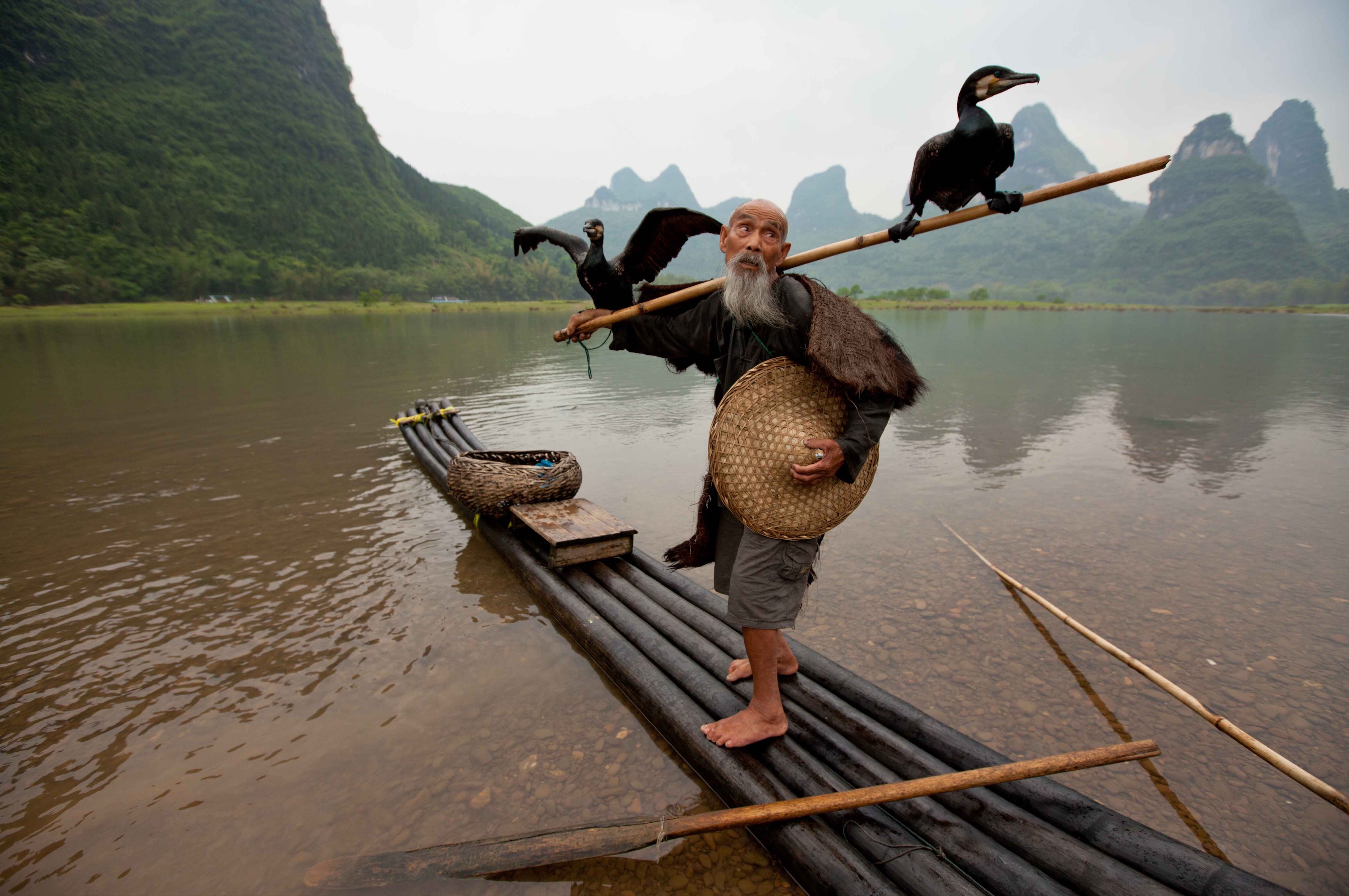 Old man on Li River, China