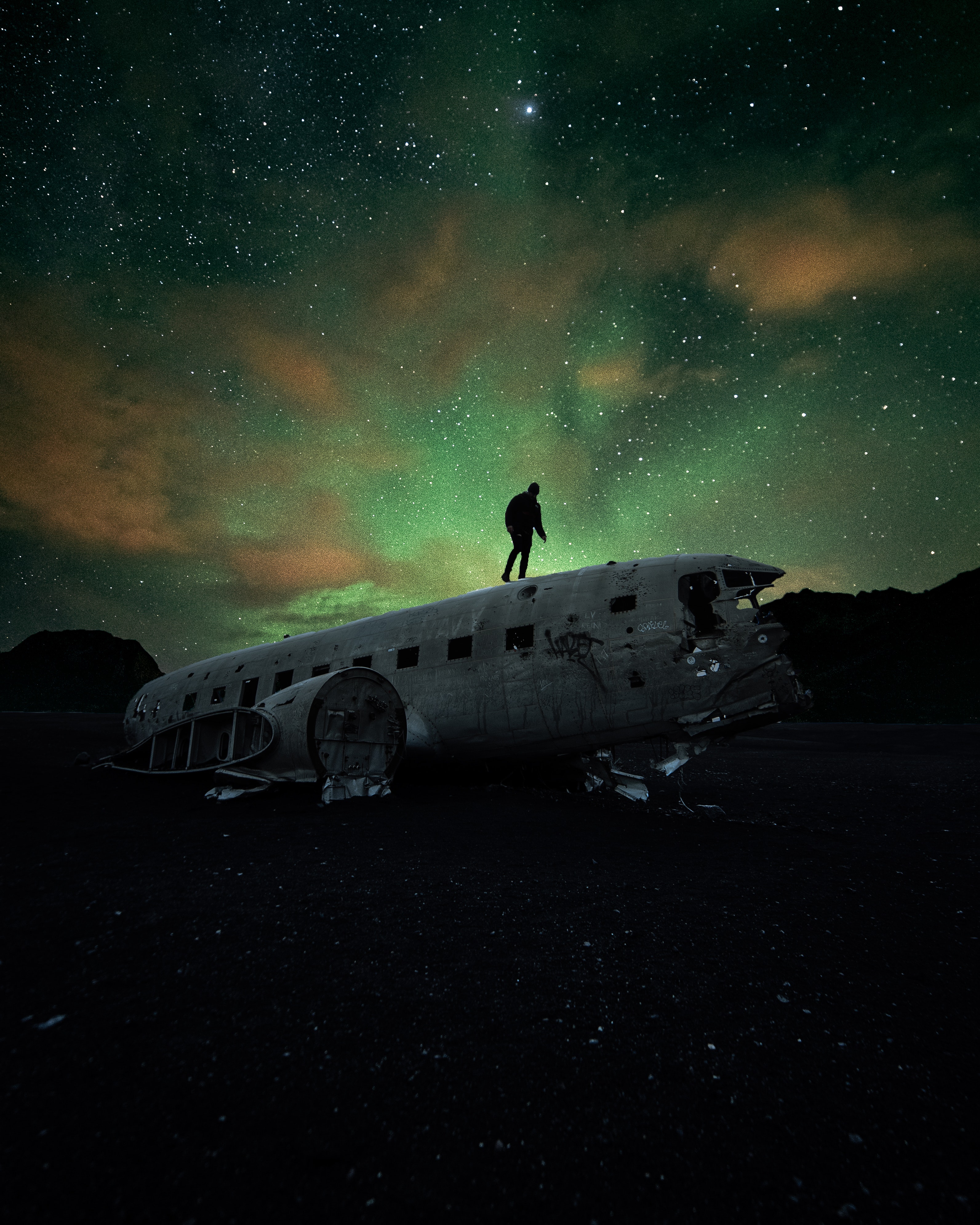 Iceland, Solheimasandur. Plane wreck, under a northern light